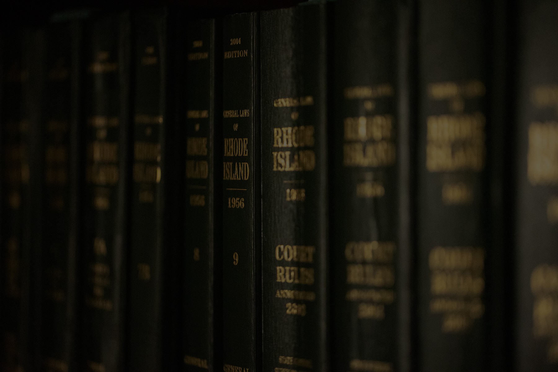 PSD_1808web2 Rhode Island court rulebooks lined up on bookshelf