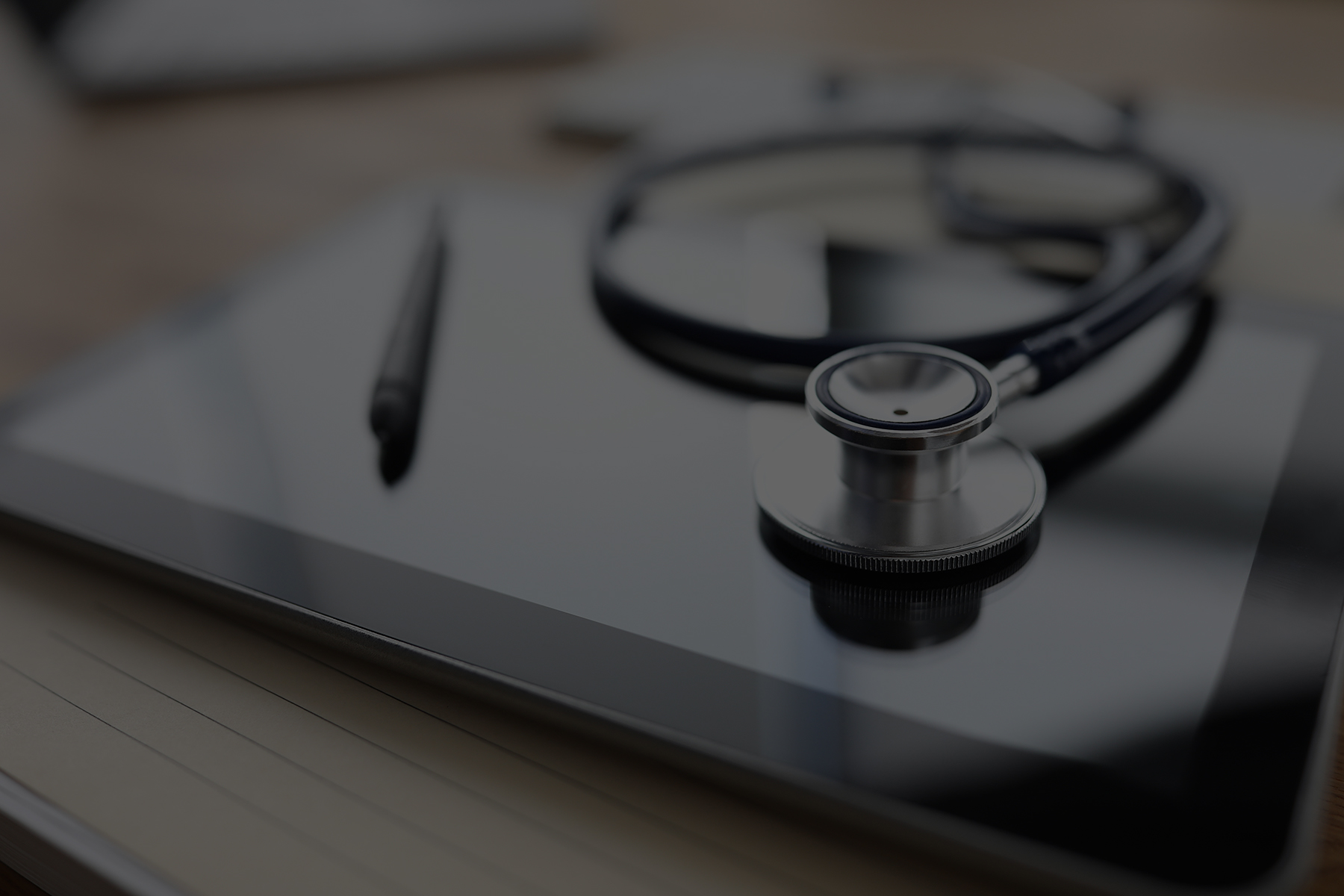 petrarca_law_medical2 Stethescope on desk with pen