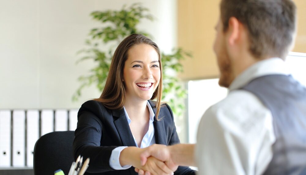 Negotiate with insurance companies. Two people shaking hands after insurance negotiation