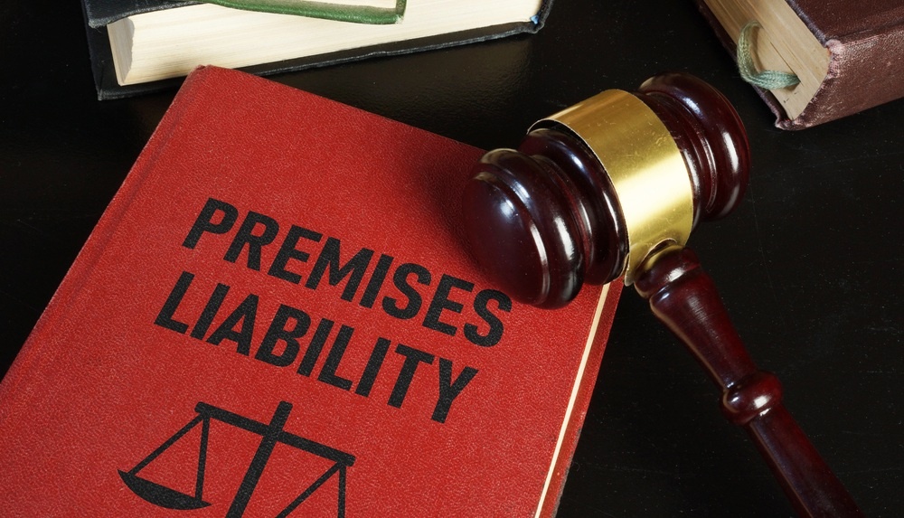 Premises liability law book with gavel on judges desk in Rhode Island