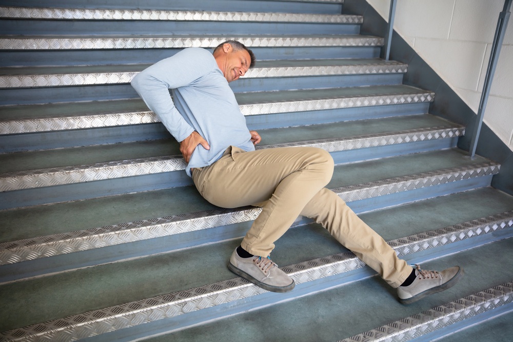 Man who suffered a slip and fall on the stairs in a premises liability case in Rhode Island