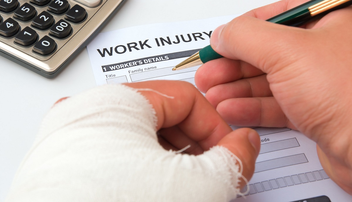 Rhode Island Workers Compensation form being filled out by an injured employee