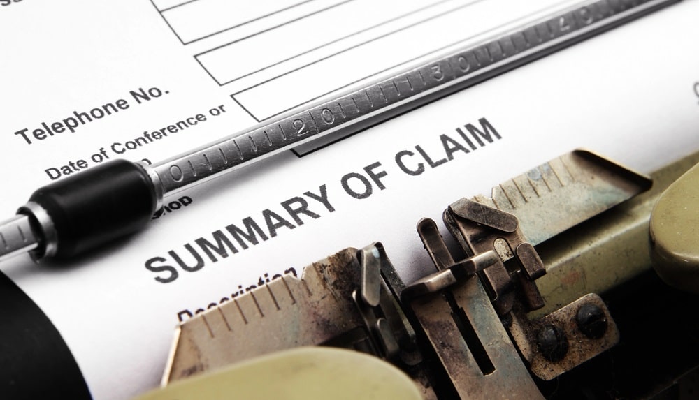 a rhode island personal injury claim form being typed by a providence personal injury lawyer