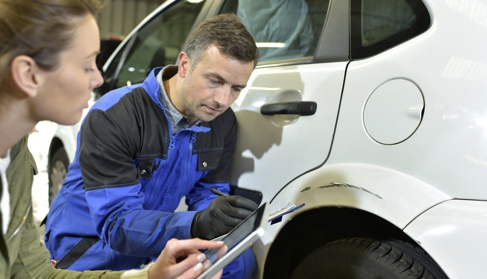 Insurance adjuster at scene of accident taking a recorded statment